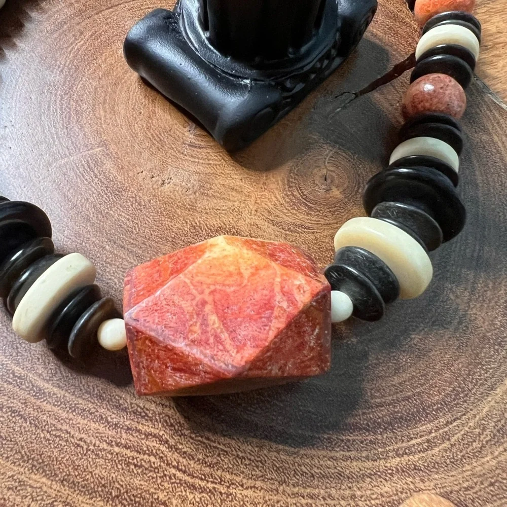 Three piece, rust and black stone and beaded costume jewelry.
